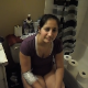 A girl is recorded taking a shit while sitting on a toilet in 2 scenes. She is either a special needs person or acts very strange. No product shown, although some subtle pooping and farting sounds. about 3 minutes.